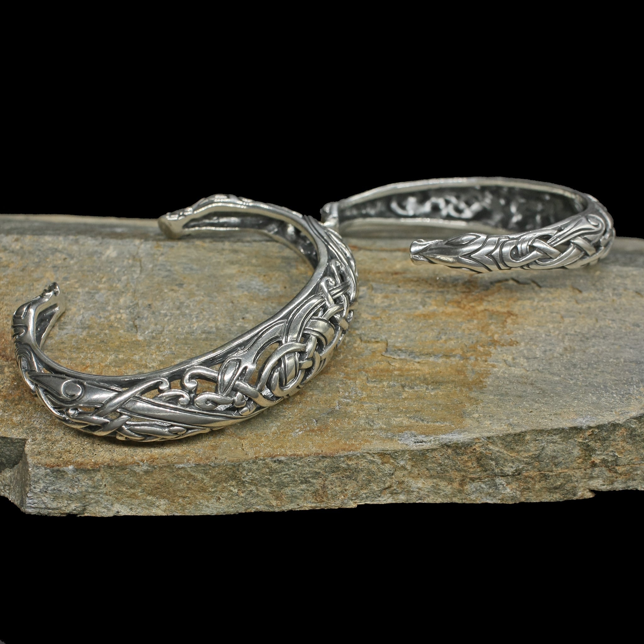 Silver Urnes Dragon Bracelets on Rock