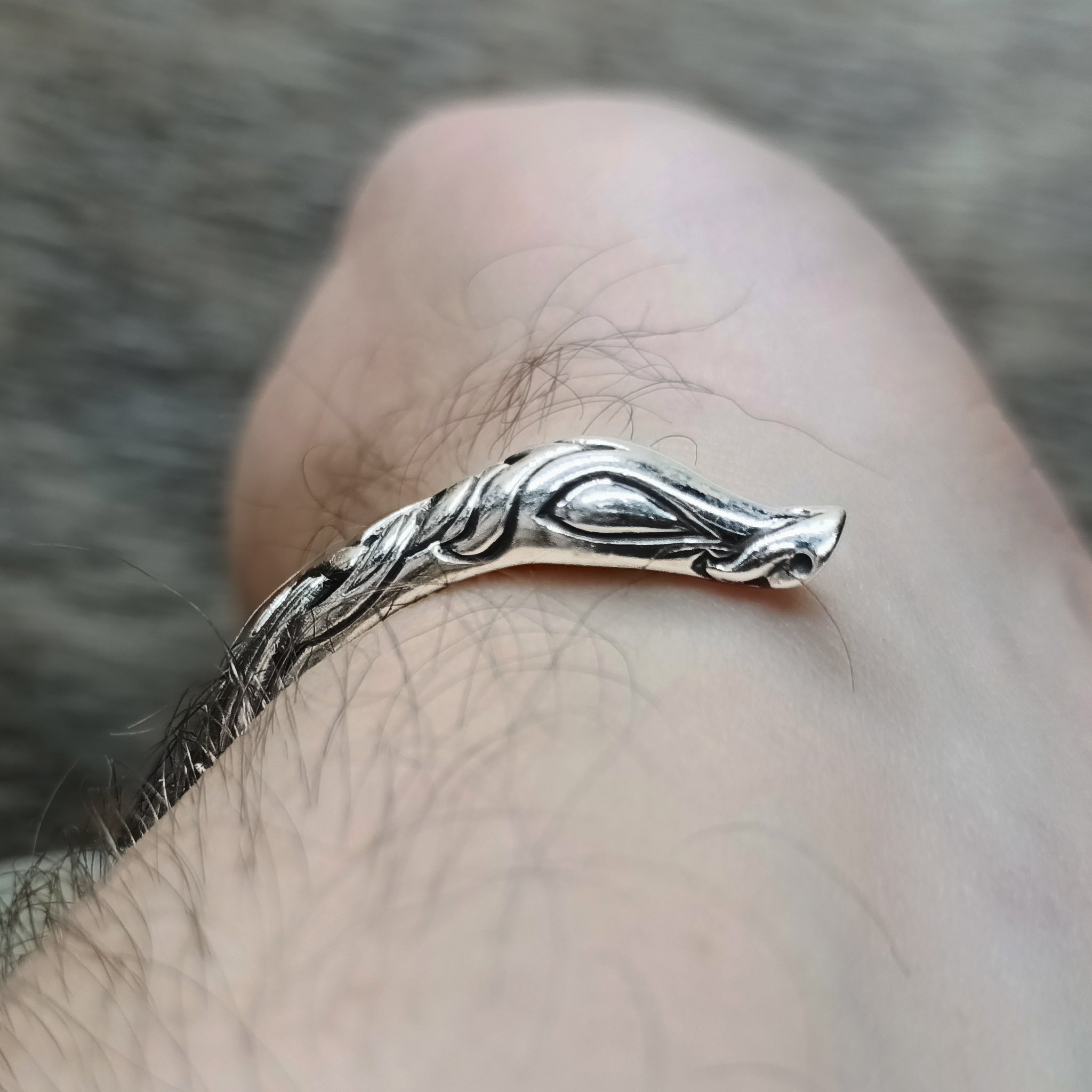 Silver Urnes Dragon Bracelet on Arm Showing Dragon Head Terminal