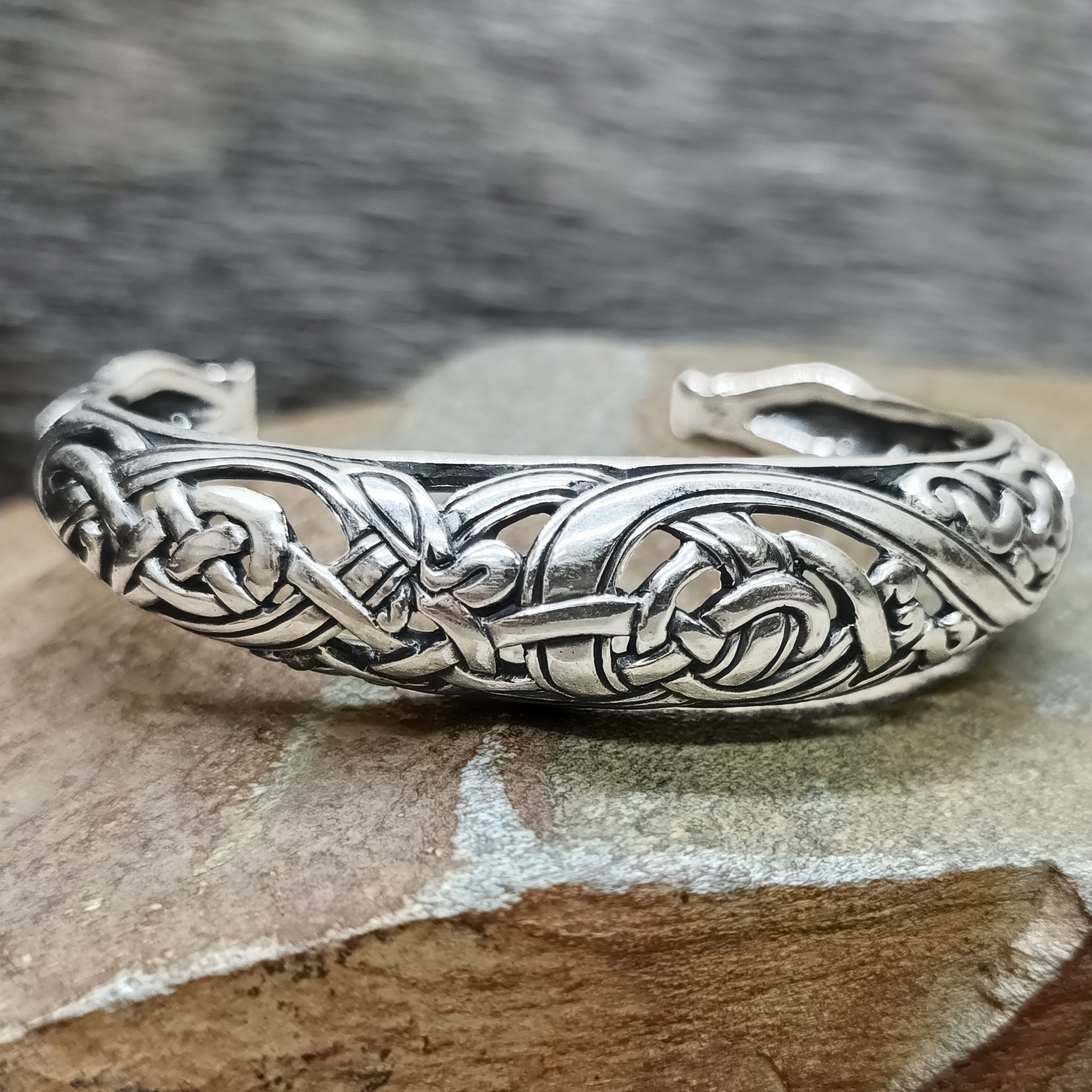 Silver Urnes Dragon Bracelet on Rock - Front View