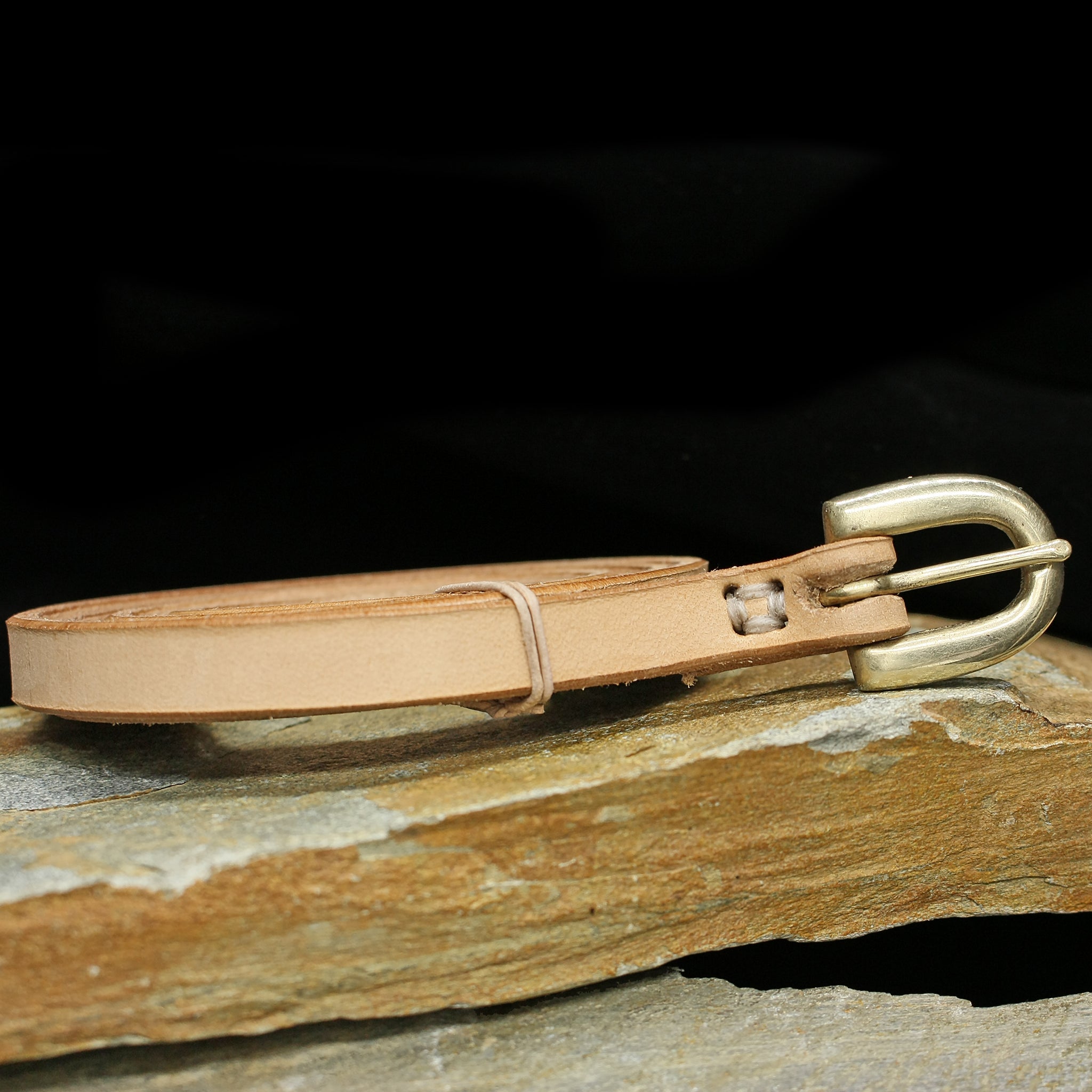 12mm (1/2 inch) leather Viking belt with brass buckle - natural veg tan - on rock
