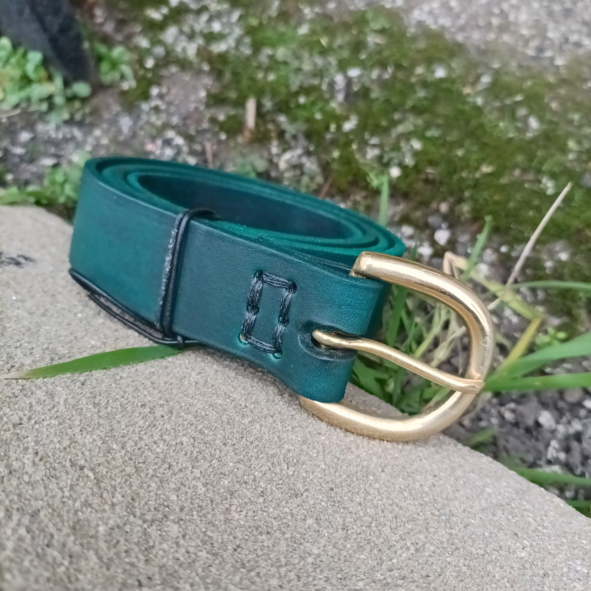 Long Green Leather Viking Belt with Brass Buckle on Rock - 32mm Width