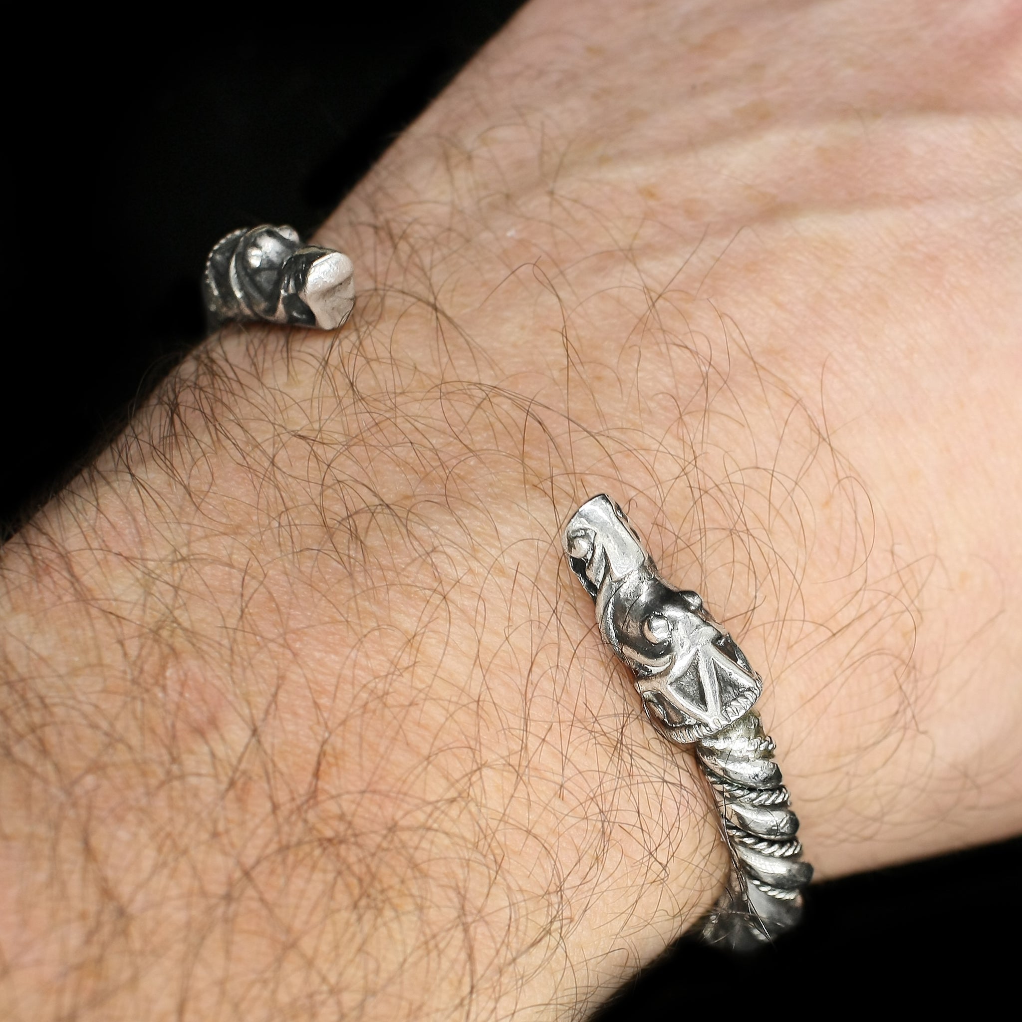 Medium Twisted Silver Arm Ring With Gotlandic Dragon Heads on Wrist