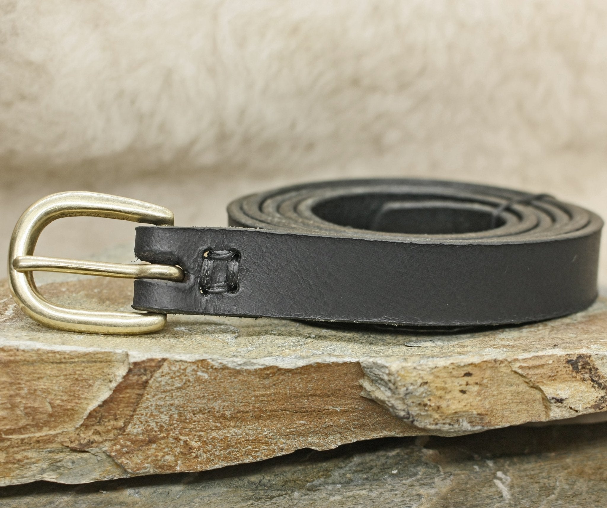 Standard Black Leather Baldric with Brass Buckle on Rock