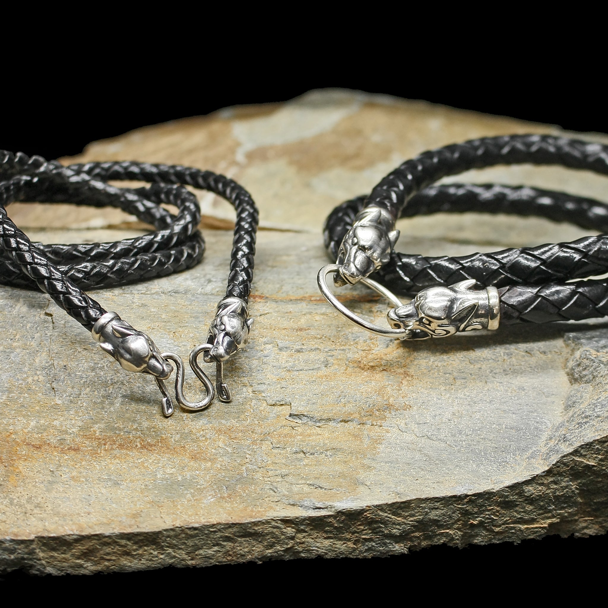 Braided Leather Necklace with Silver Ferocious Wolf Heads on Rock