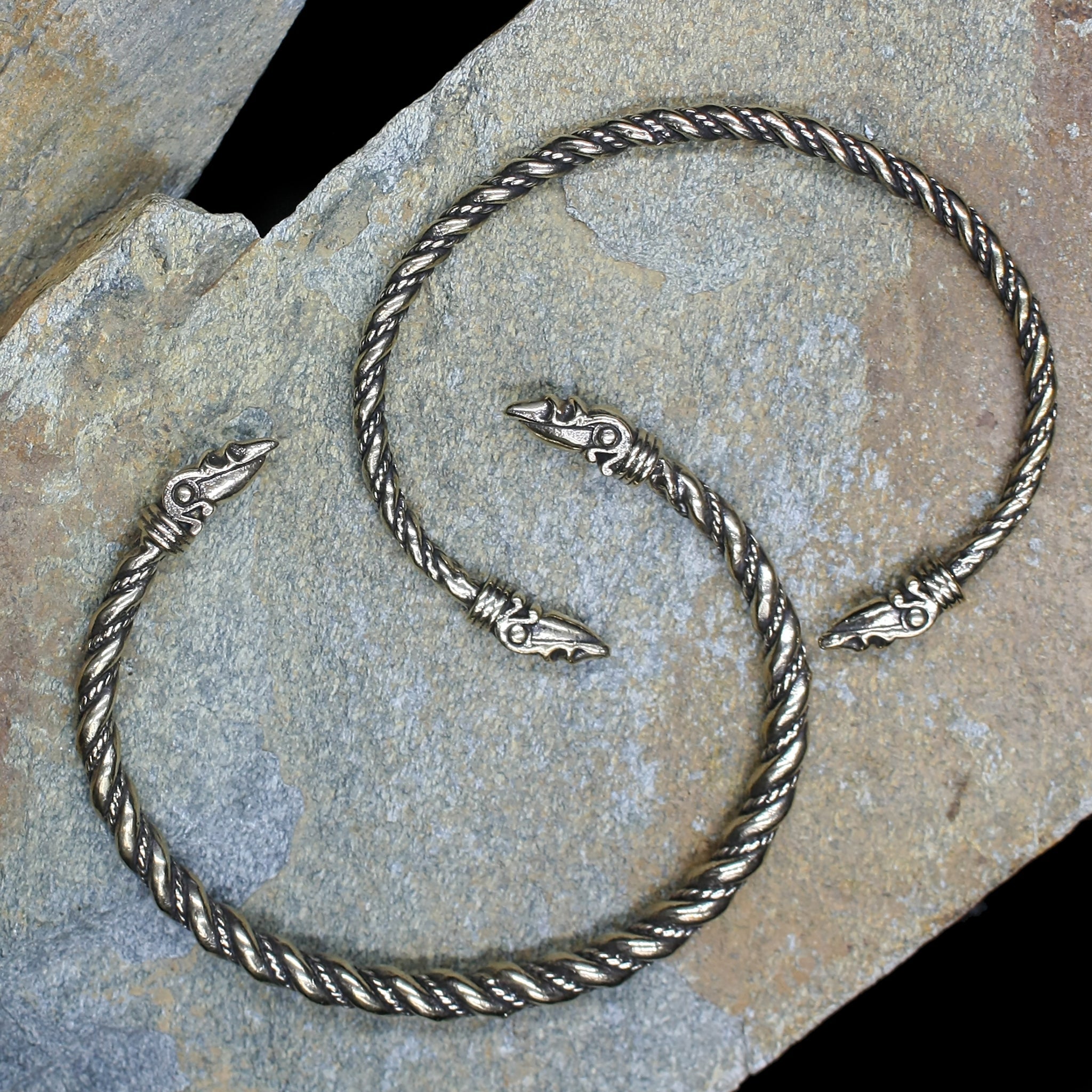 Twisted Bronze Bracelet With Raven Heads on Rock