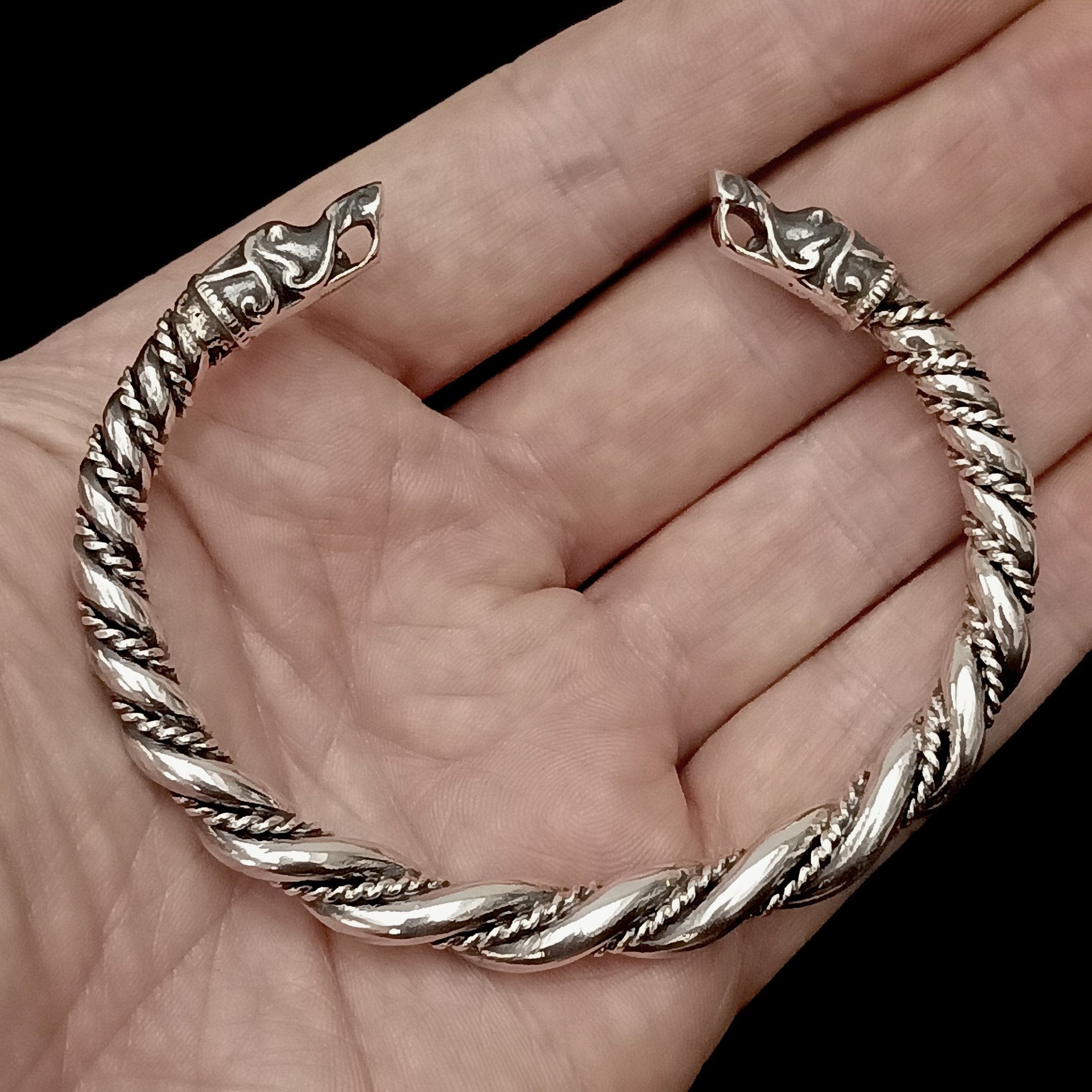 Twisted Silver Arm Ring / Bracelet With Gotlandic Dragon Heads on Hand