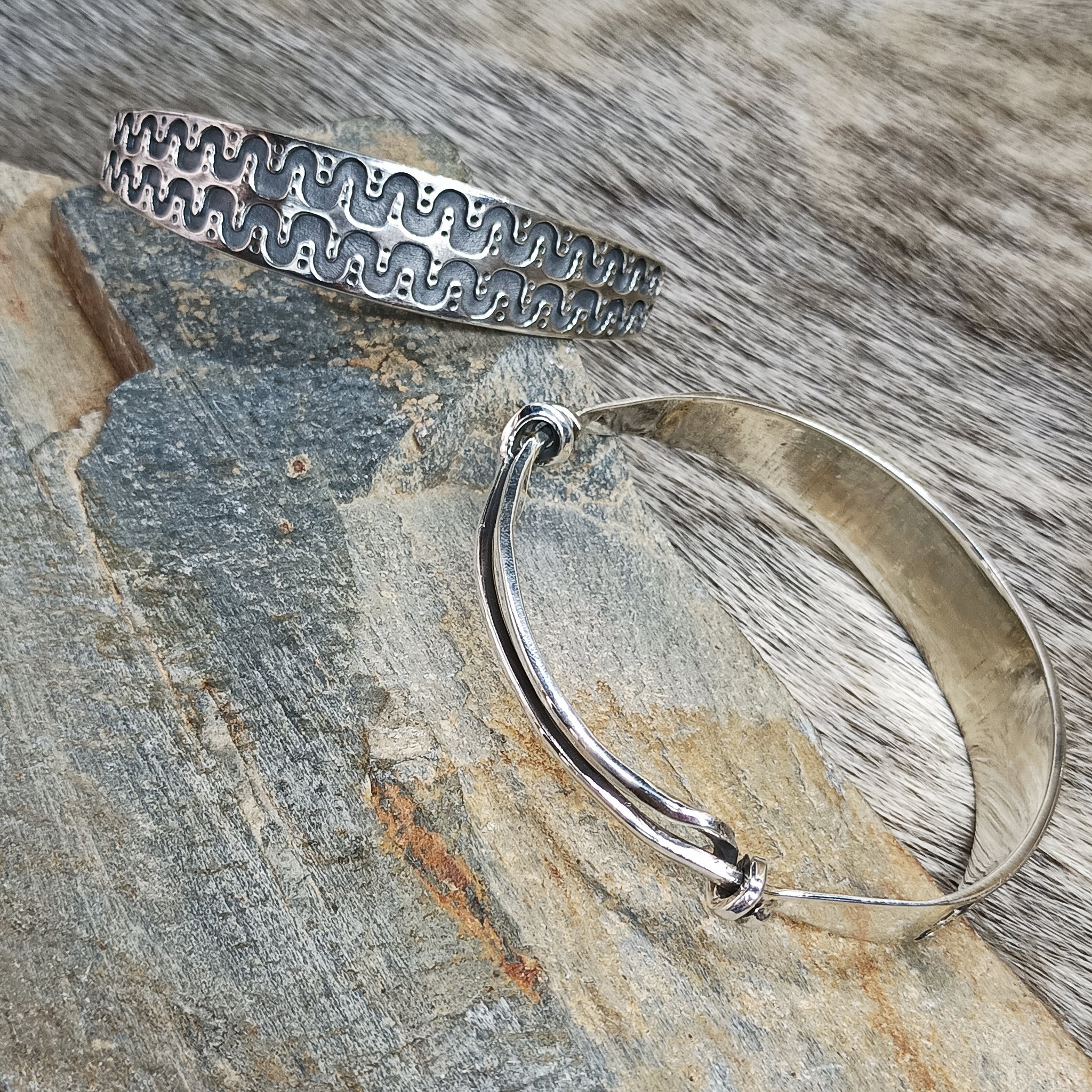 Adjustable Silver Viking Arm Rings From Halleby on Rock - Front and Back