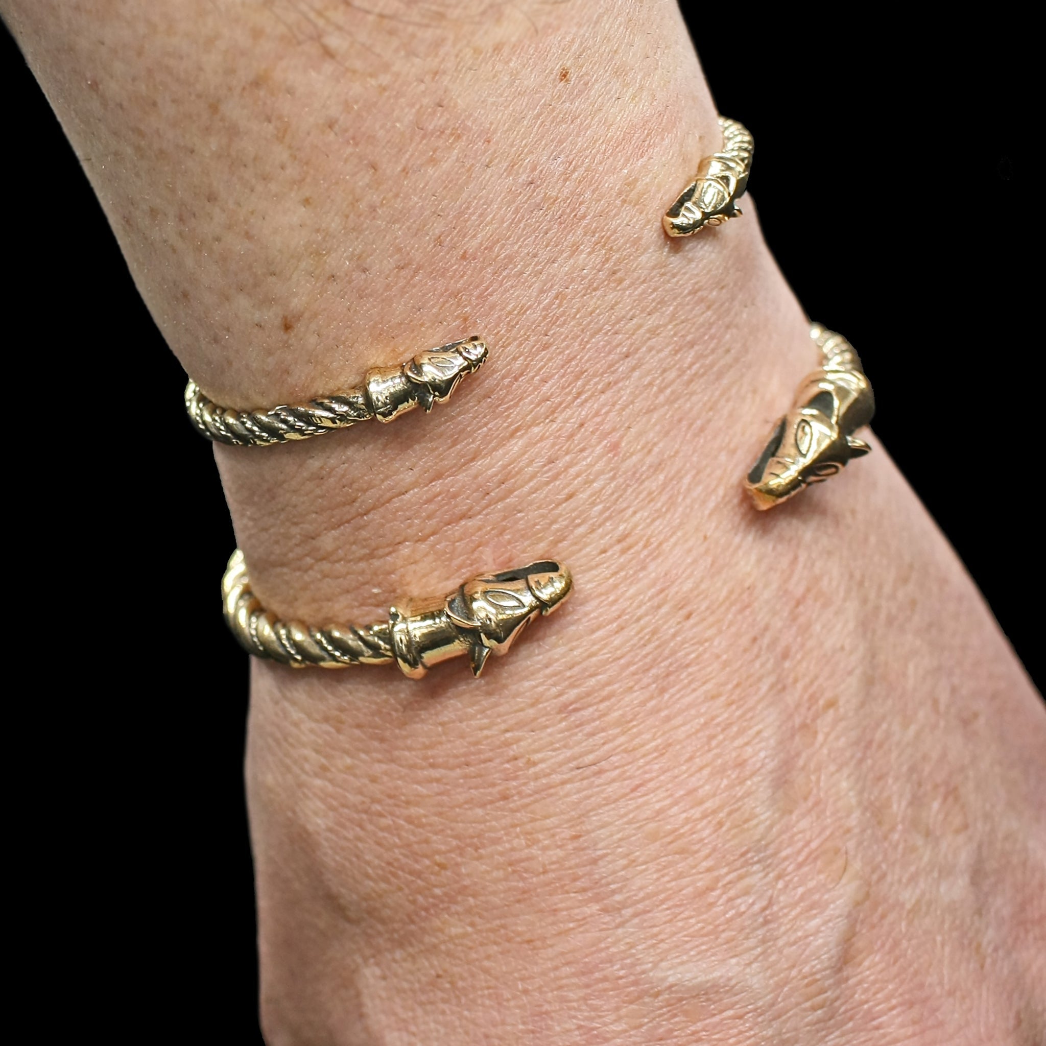 Twisted Bronze Bracelet With Icelandic Wolf Heads on Wrist