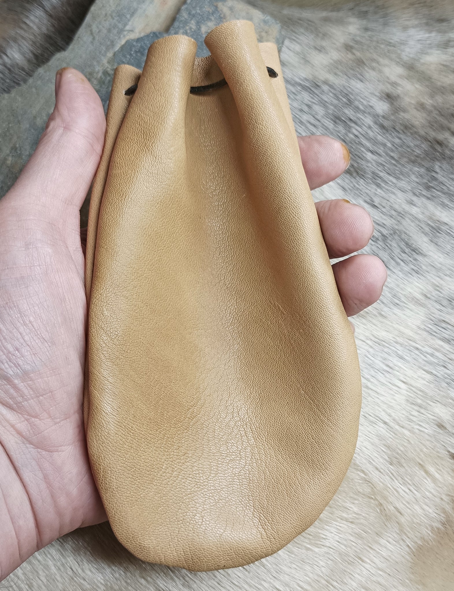 Medium Leather Draw String Pouch in Hand