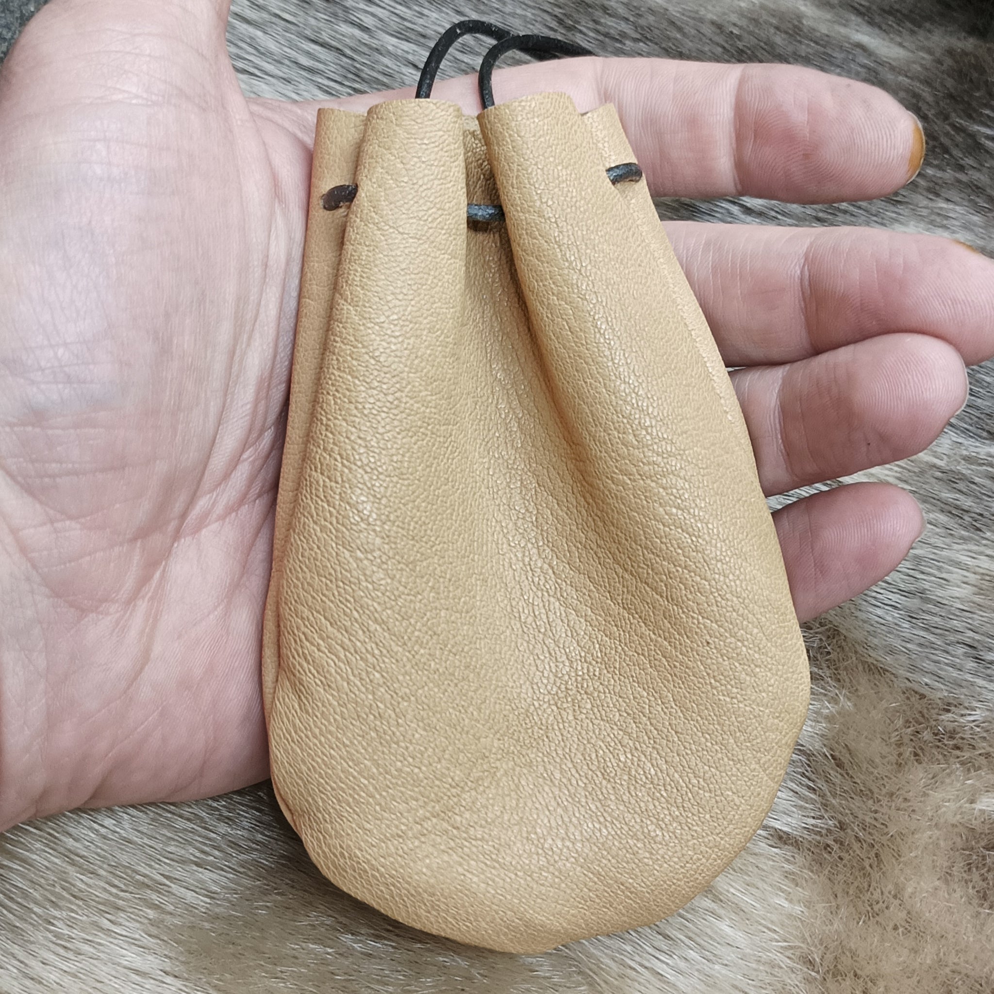 Small Leather Draw String Pouch in Hand