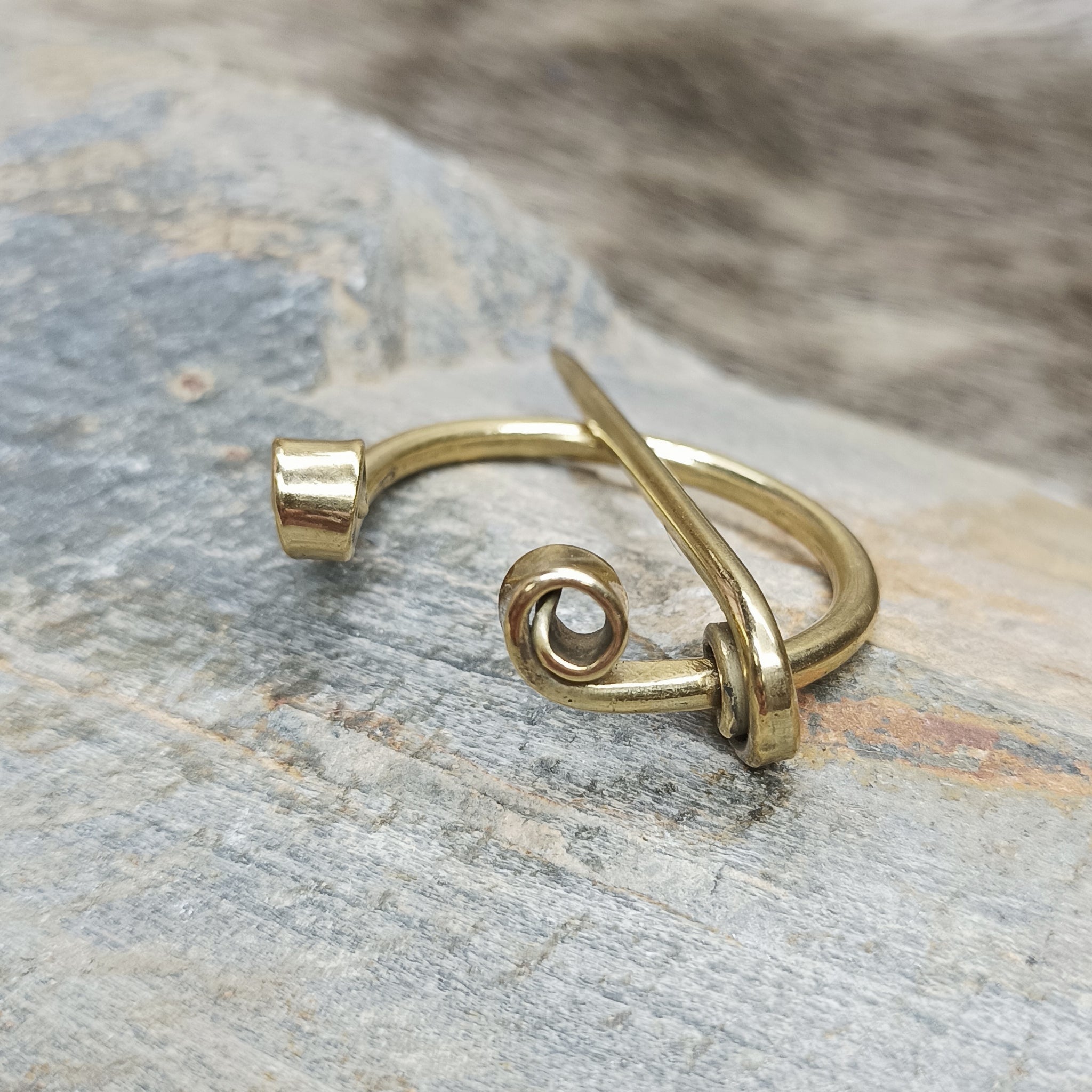 30mm Brass Cloak Pin / Clothes Pin on Rock - Side Angle View