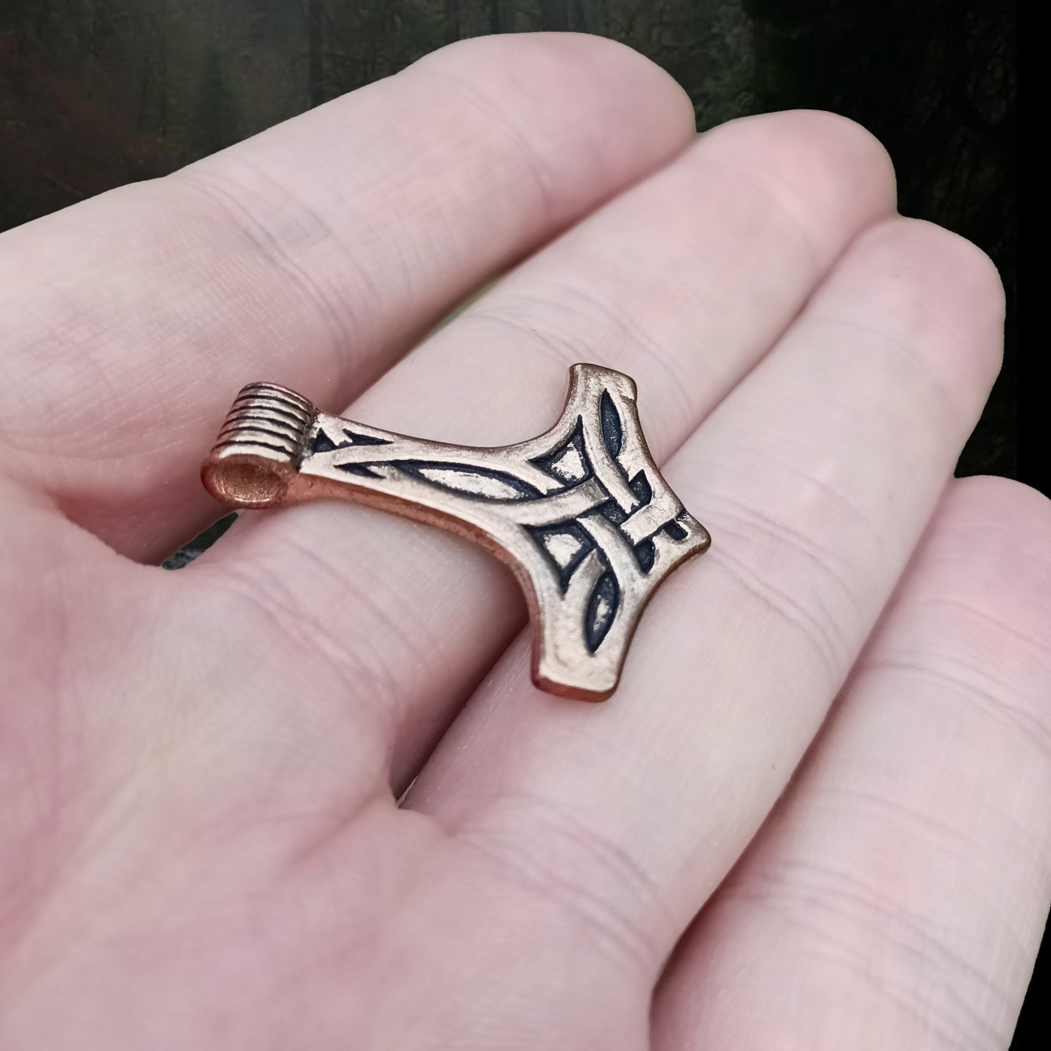 Bronze Thors Hammer Pendant with Knotwork Design on Hand - Side Angle