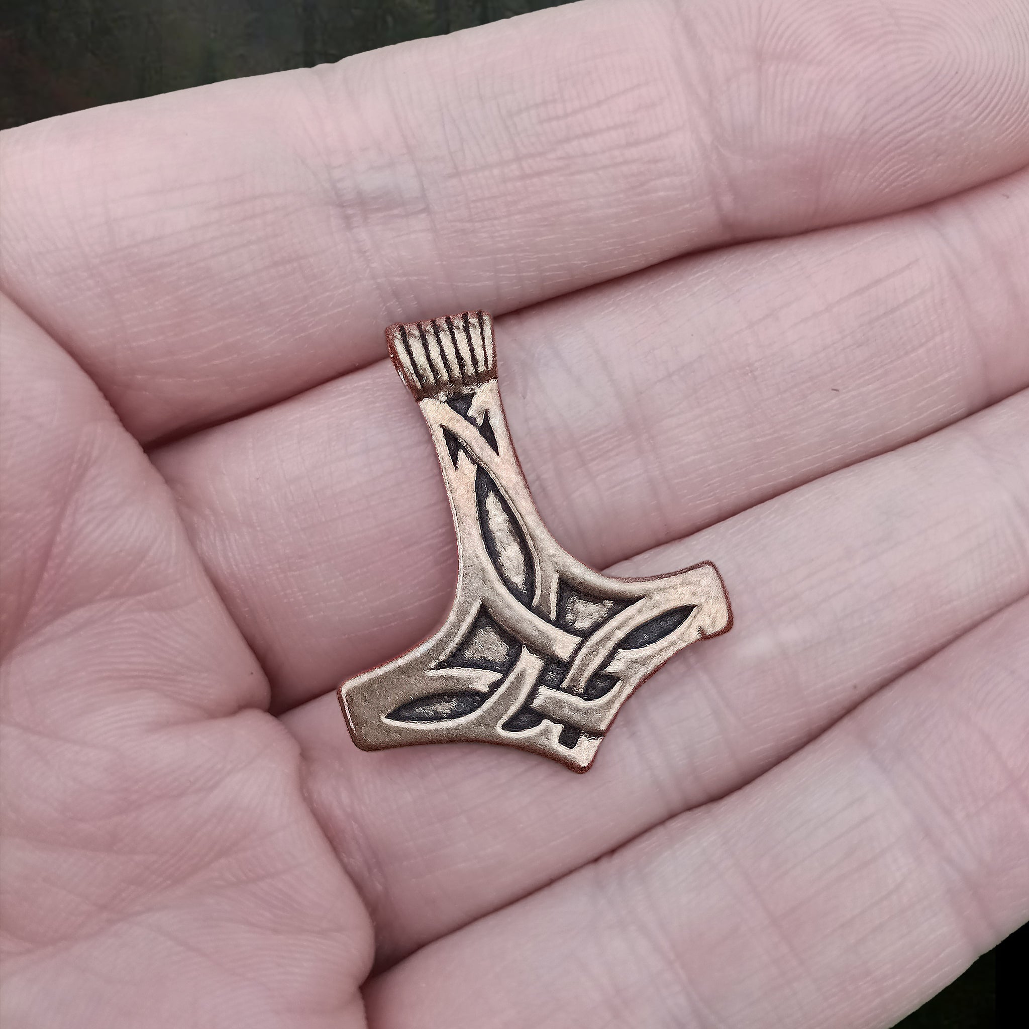 Bronze Thors Hammer Pendant with Knotwork Design on Hand