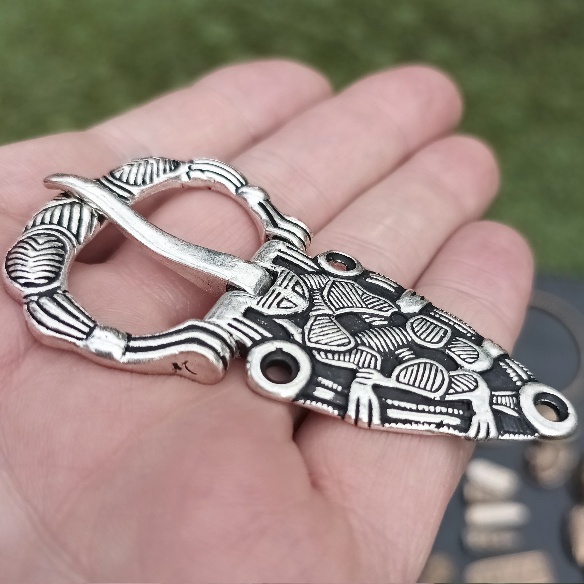 Silver Plated Oseberg Style Viking Buckle on Hand - Side Angle View