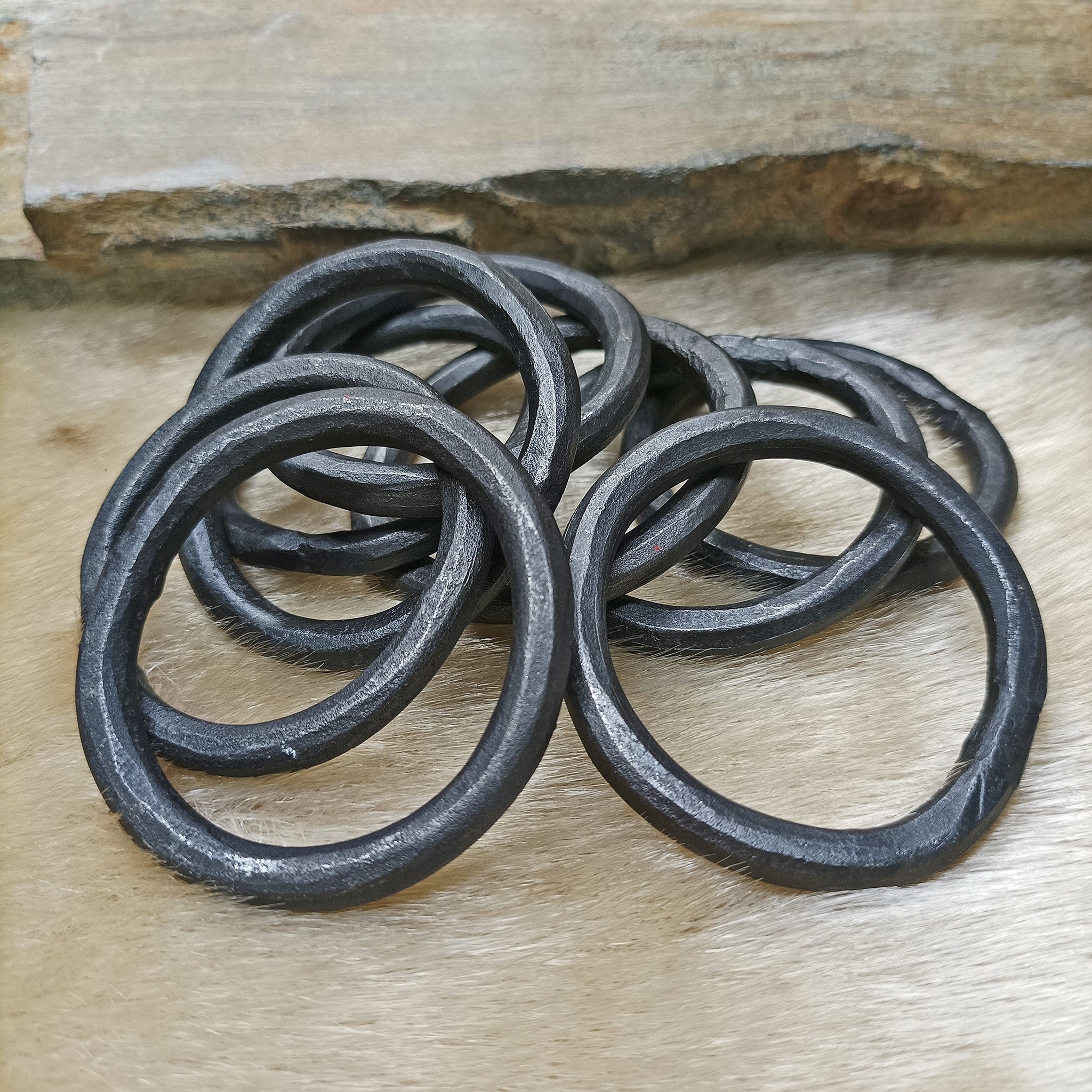 Hand-Forged Large Iron O Rings on Fur