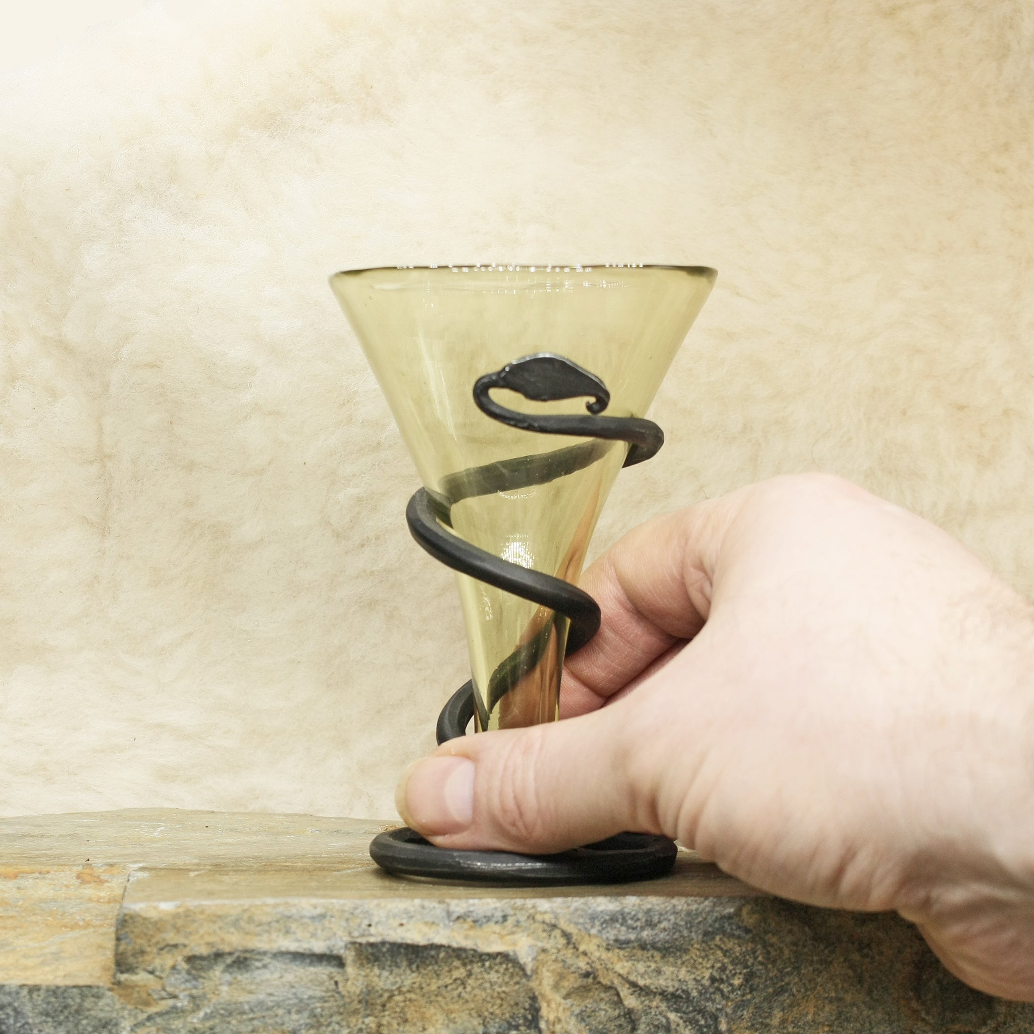 Plain Cone Mead Glass with Iron Snake Stand on Rock with Hand