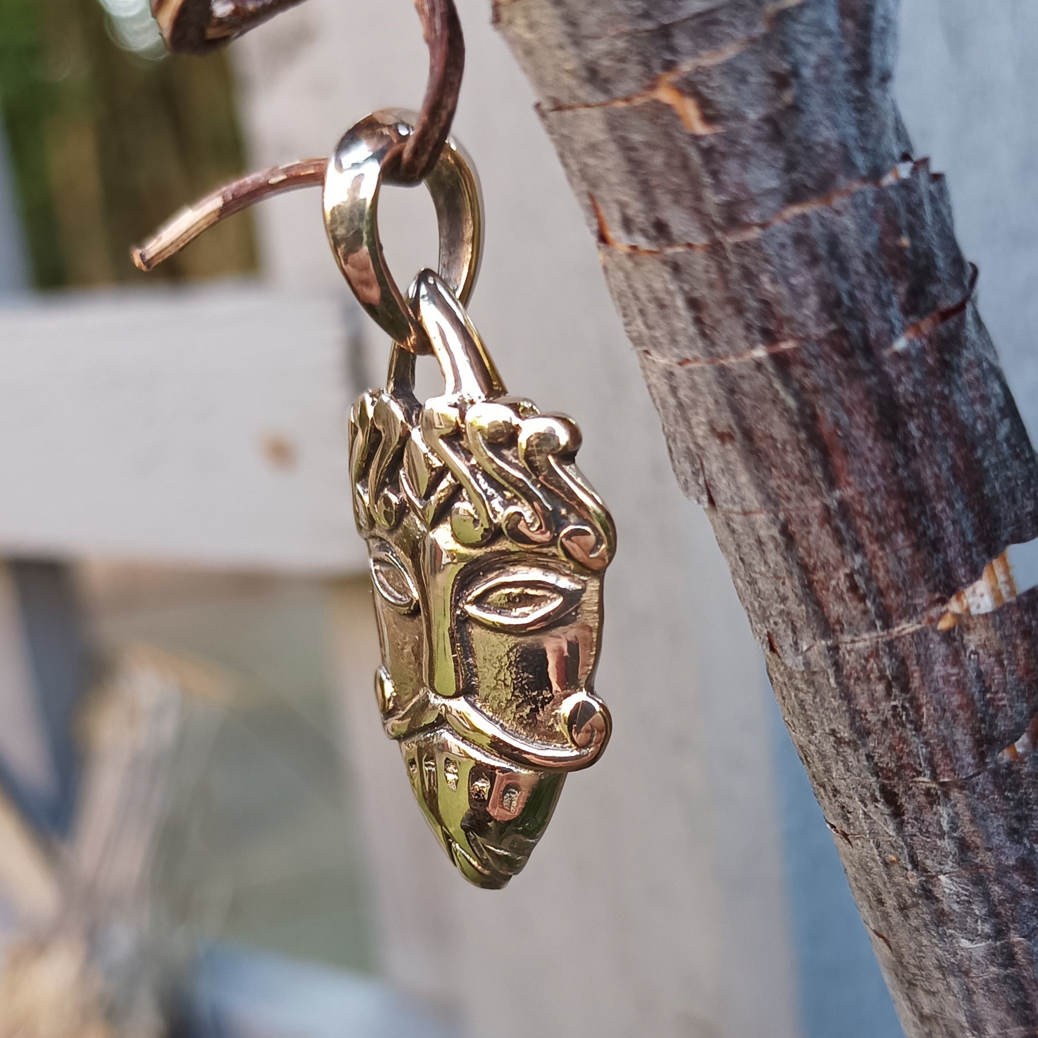 Bronze Loki Mask Pendant by Kai Uwe Faust - Hanging from Tree