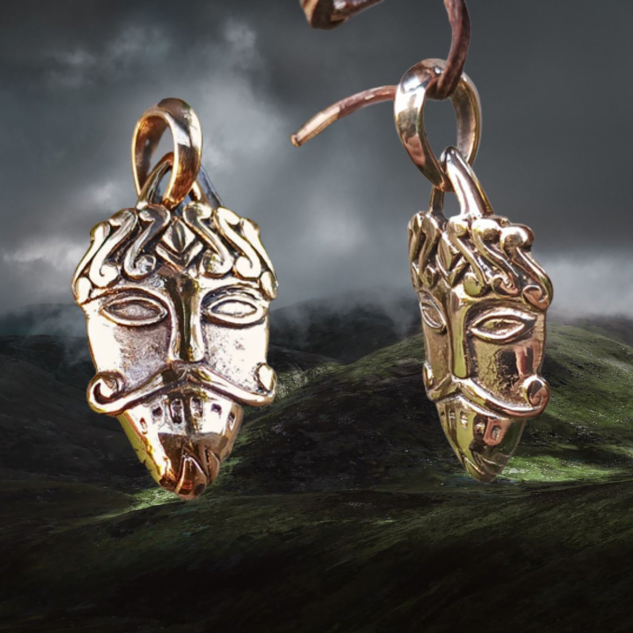 Bronze Loki Mask Pendant on Mystical Mountains Background