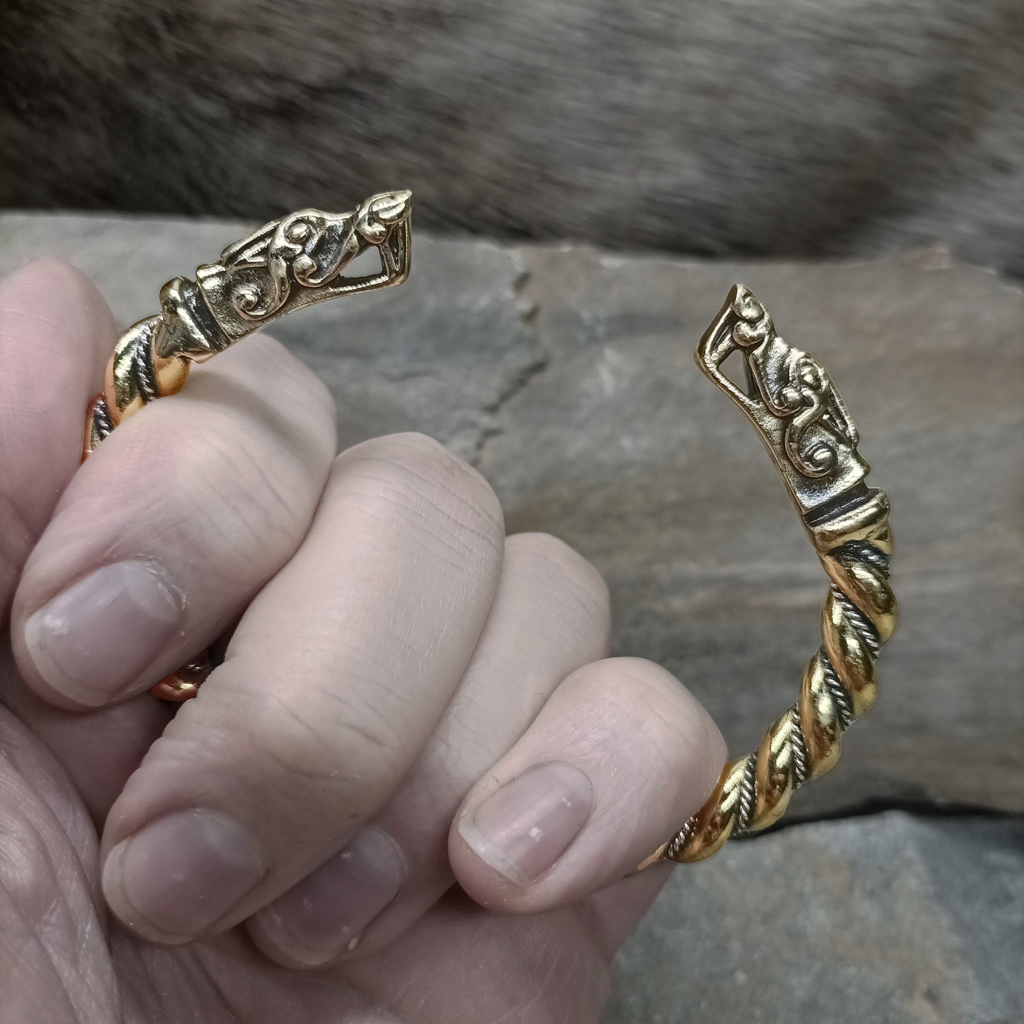 Twisted Bronze and Silver Bracelet With Gotlandic Dragon Heads in Gripped Hand