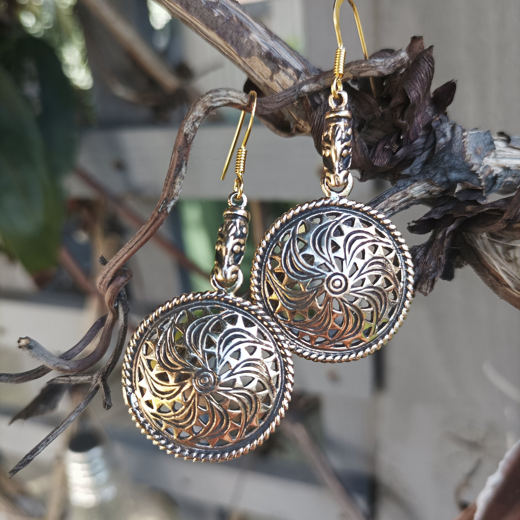 Bronze Gotland Sun Wheel Earrings Hanging in Tree