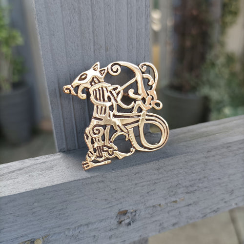 Bronze Jelling Wolf Viking Brooch on Fence