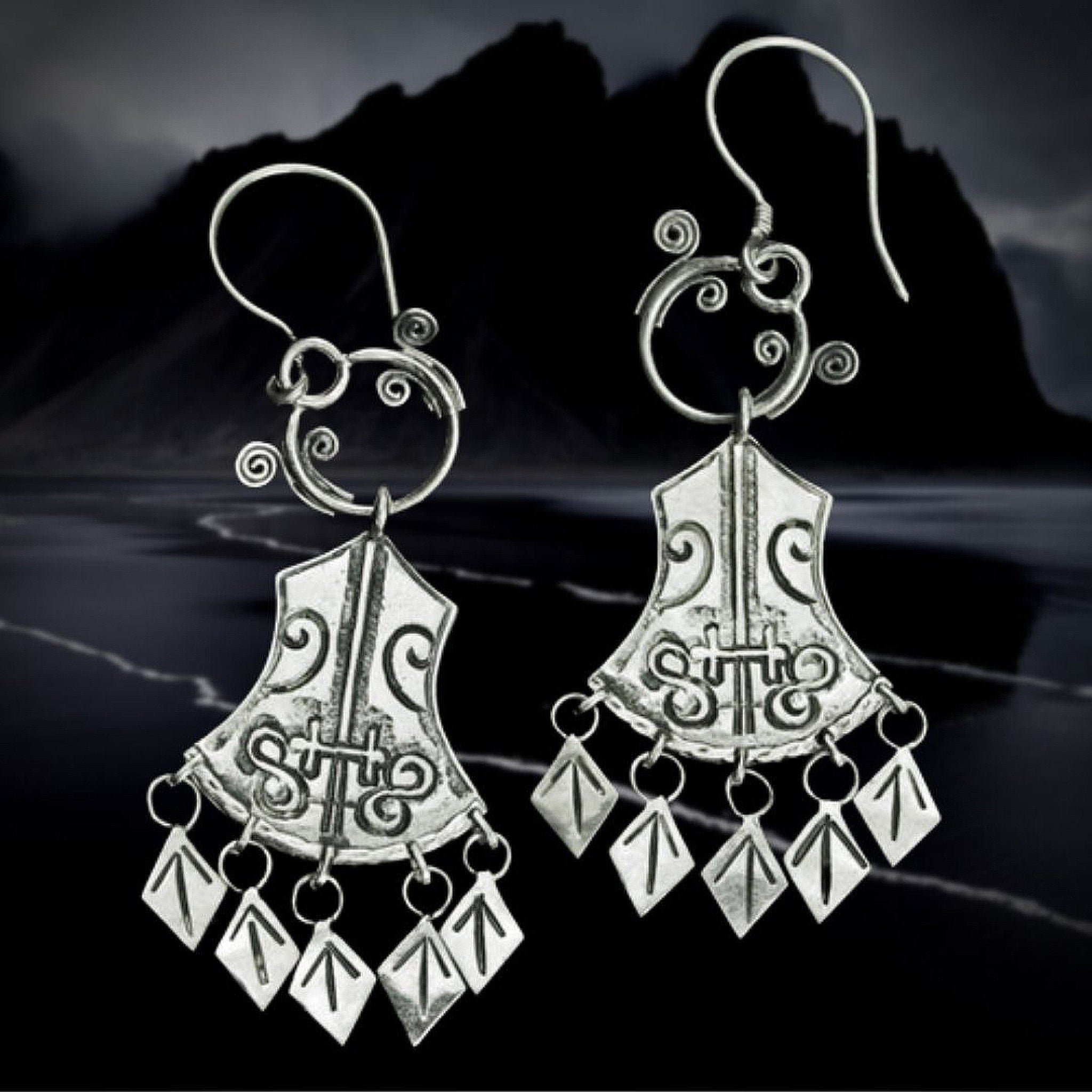 Silver 5 T Rune Norwegian Viking Earrings on Night Coast Background