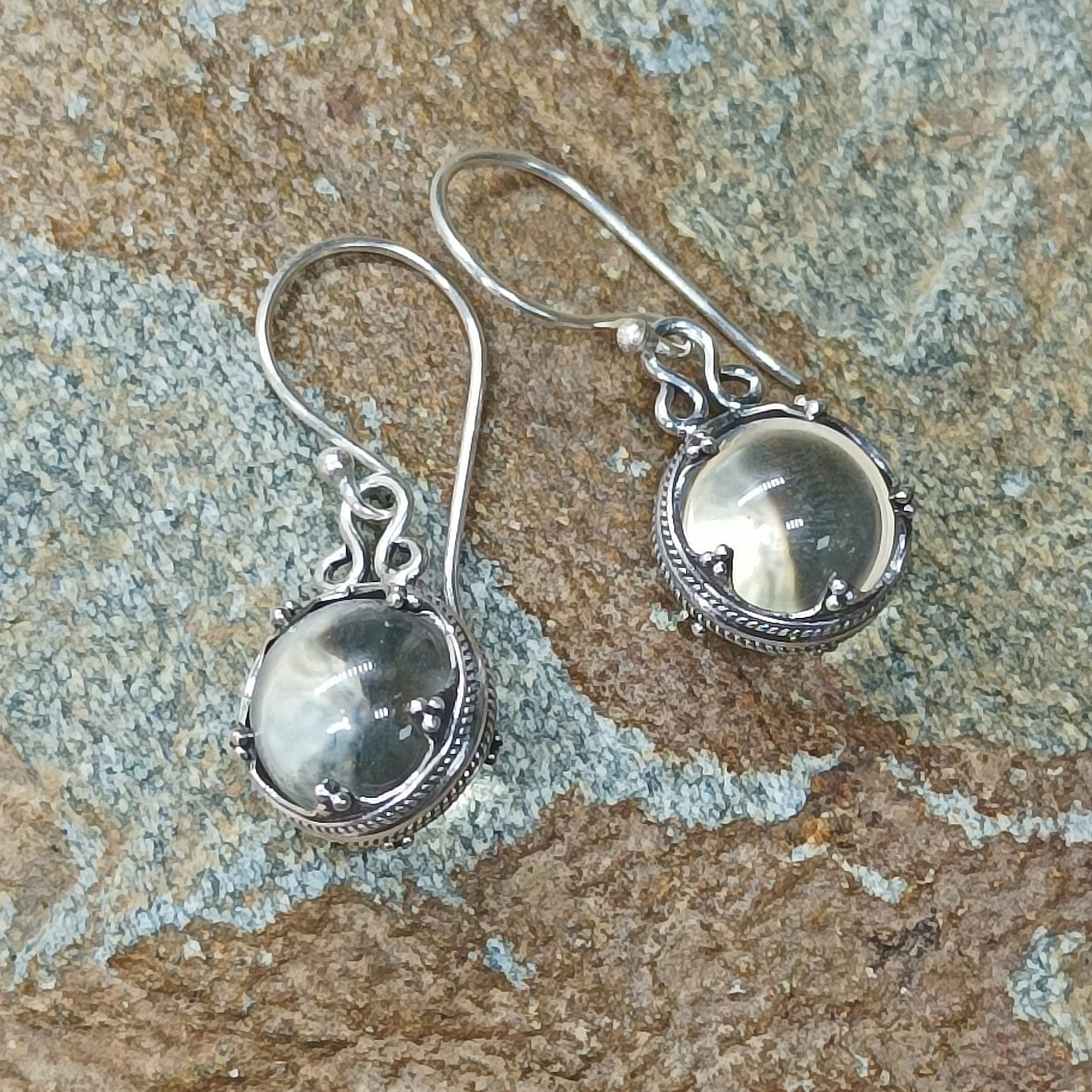 Silver Gotland Crystal Ball Earrings on Rock