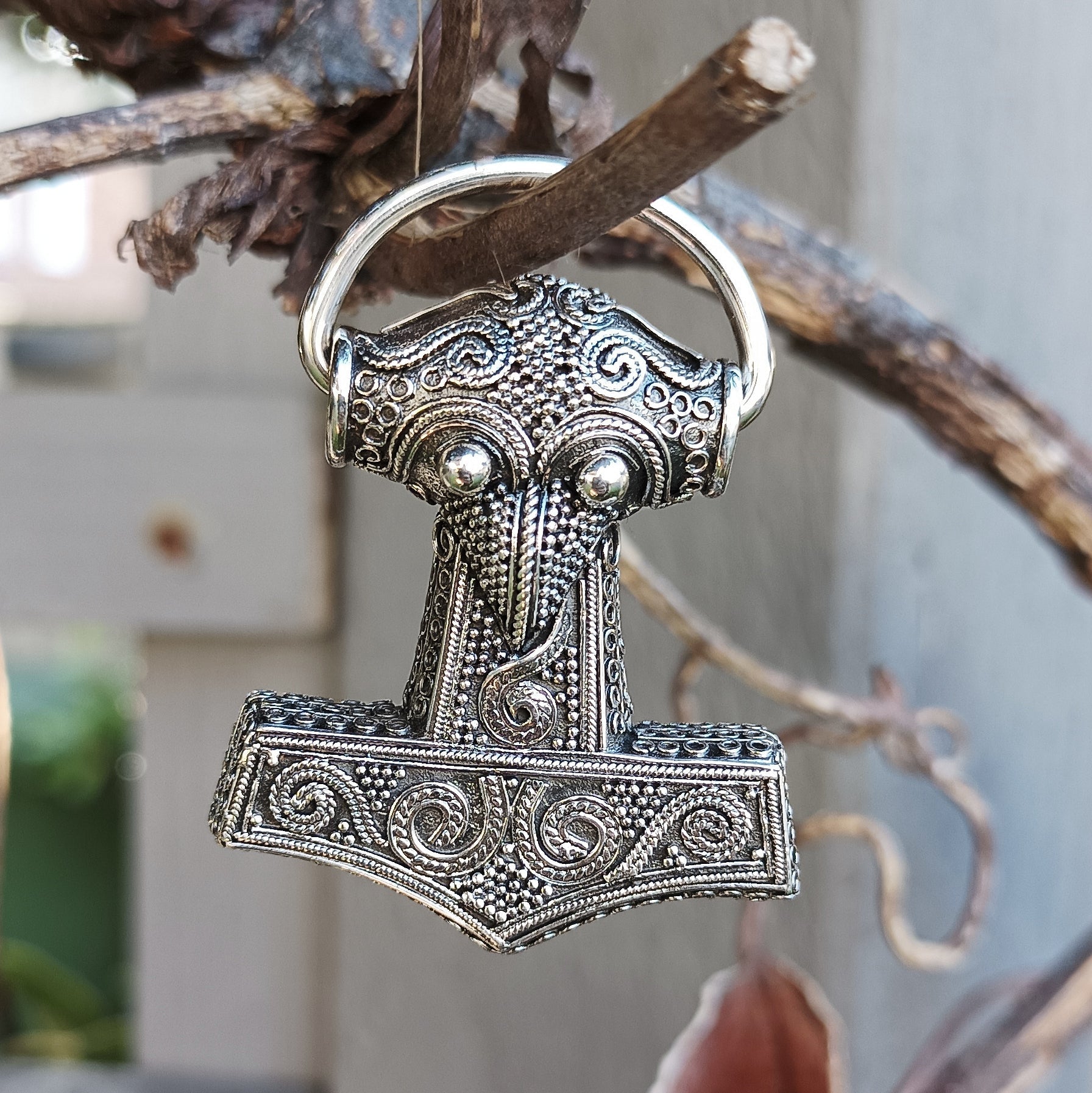 Silver Filigree Thors Hammer Pendant Replica from Kabara Hanging in Tree