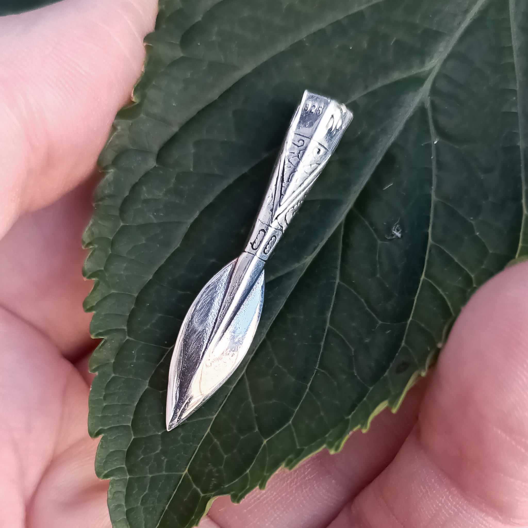 Silver Finnish Spear Head Pendant on Leaf