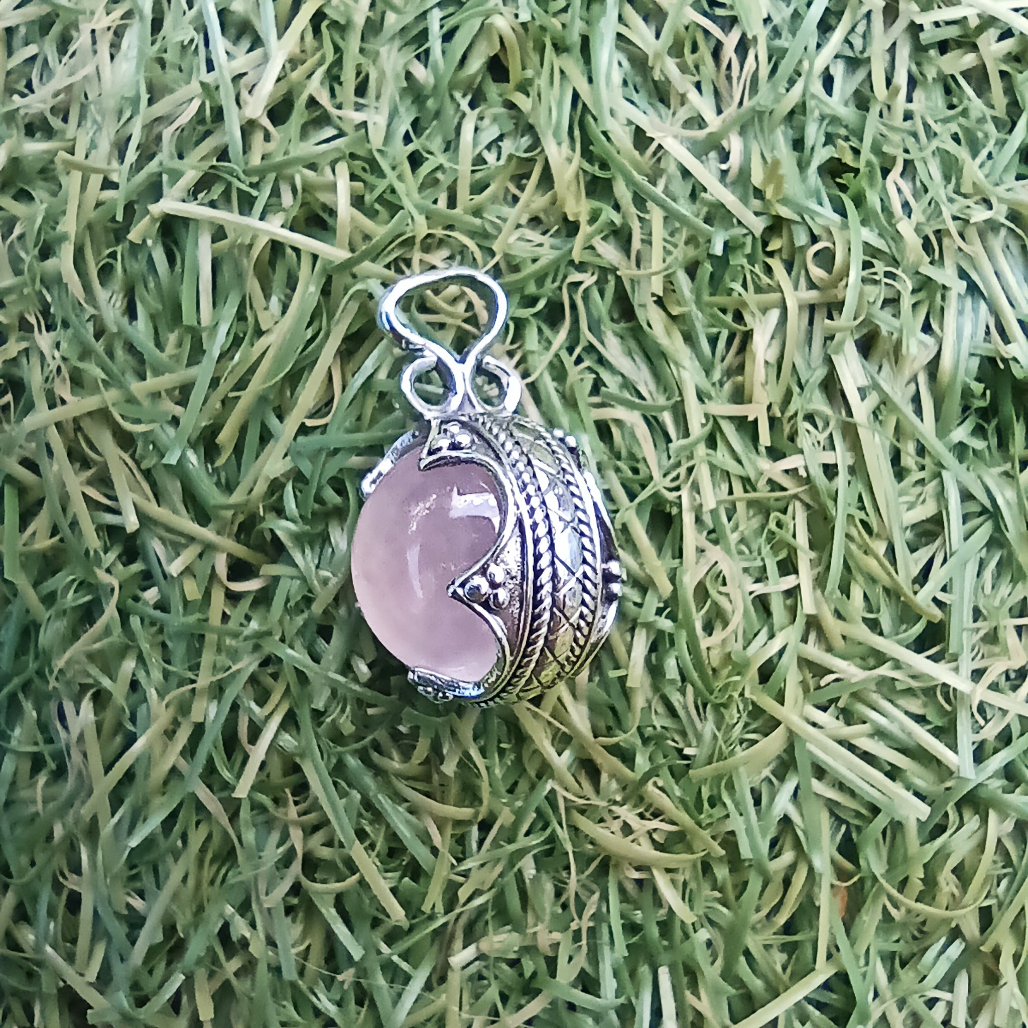 Small Silver Gotland Rose Quartz Ball Pendant on Grass - Side View