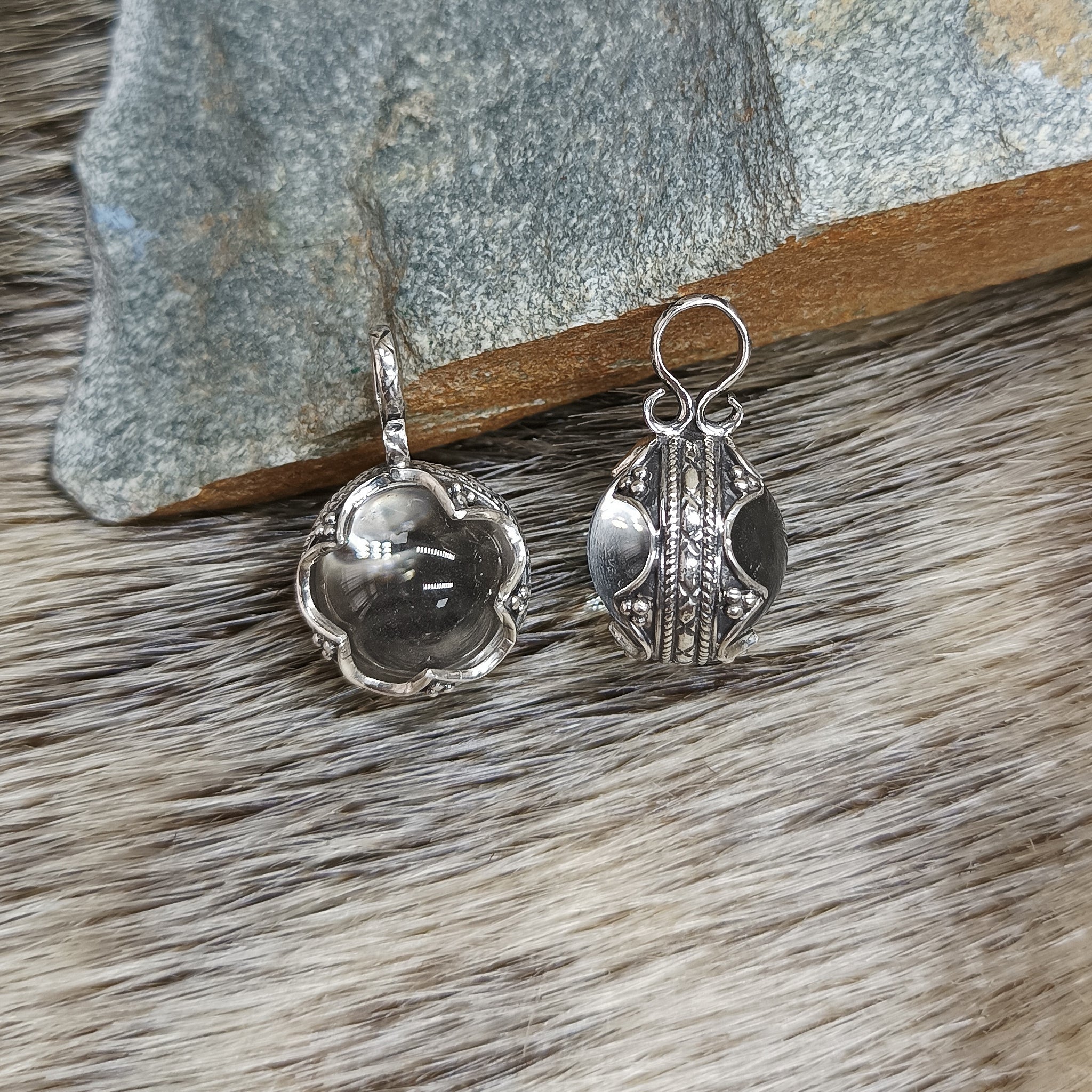 Small Silver Gotland Crystal Ball Pendants - Front & Side View on Seal Skin