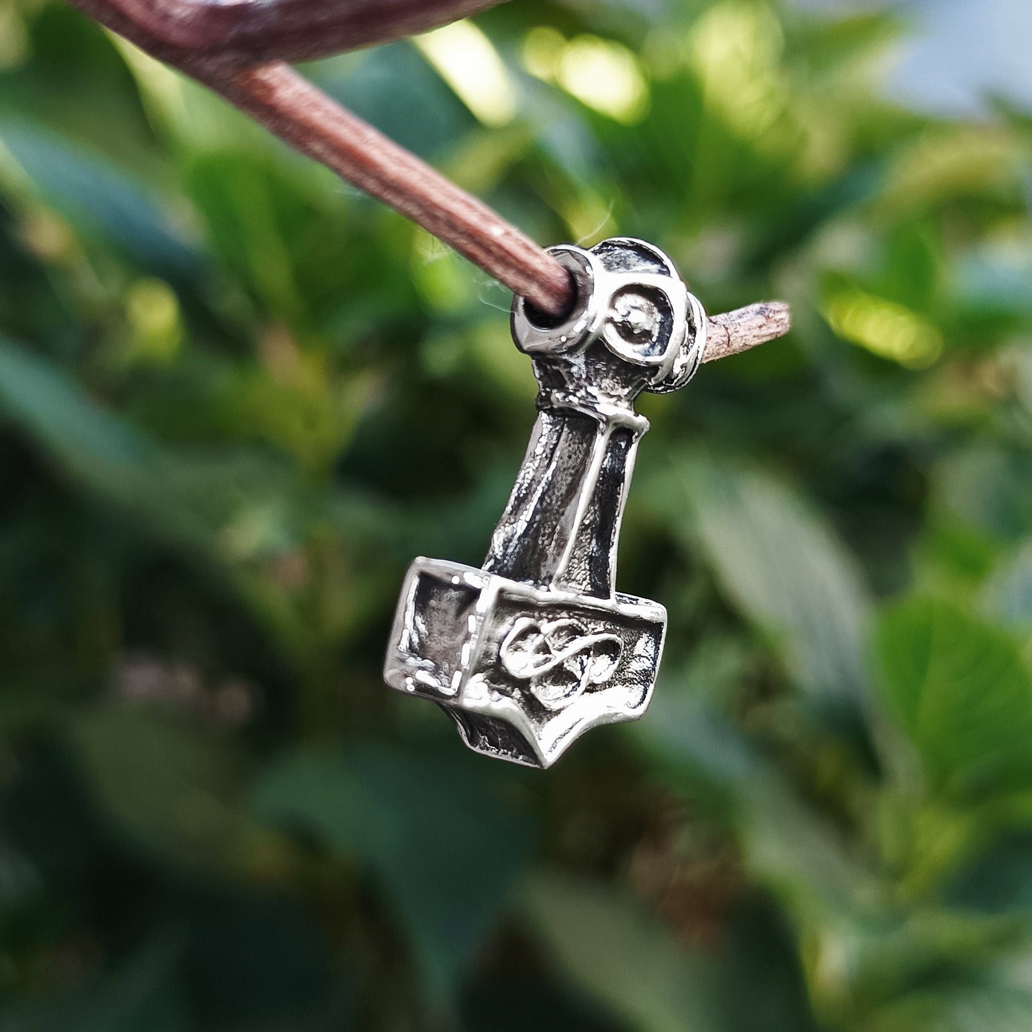 Small Silver Thunder Thors Hammer Pendant in Tree - Side Angle View