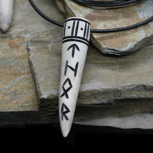 Thor Antler Runic Pendant on Leather Thong on Rock