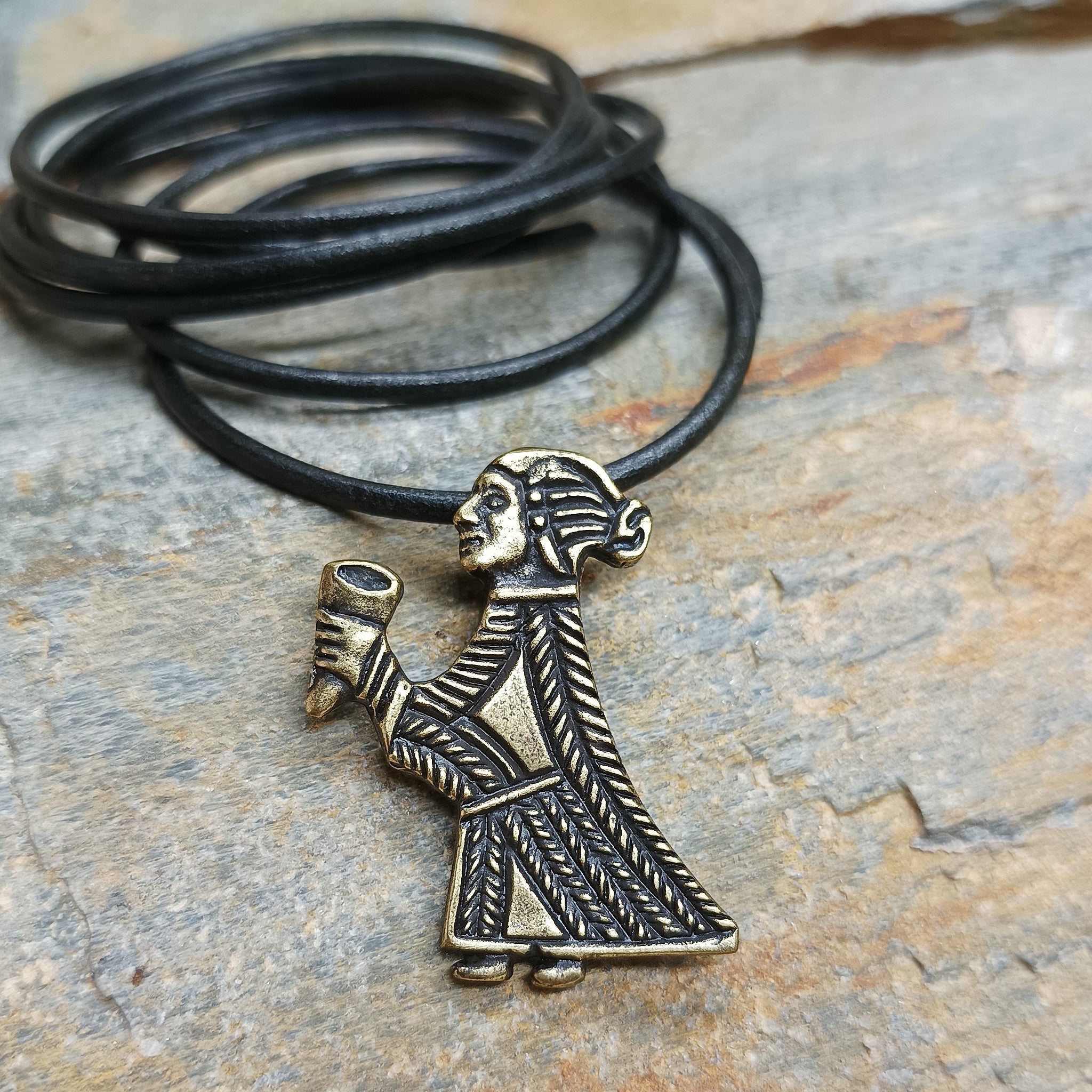 Bronze Valkyrie Pendant on Black Leather Thong - on Rock