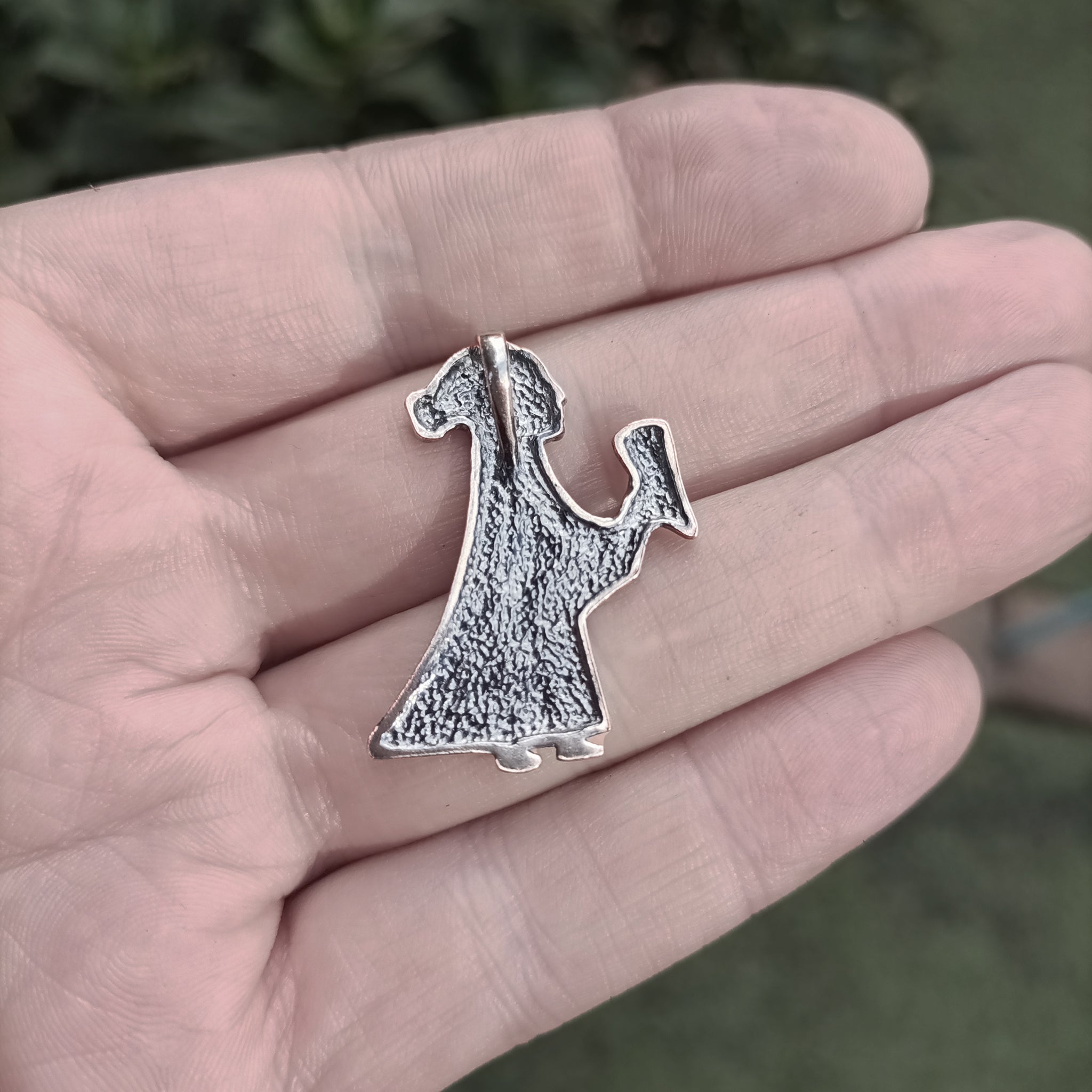 Silver Valkyrie Pendant on Hand - Back View