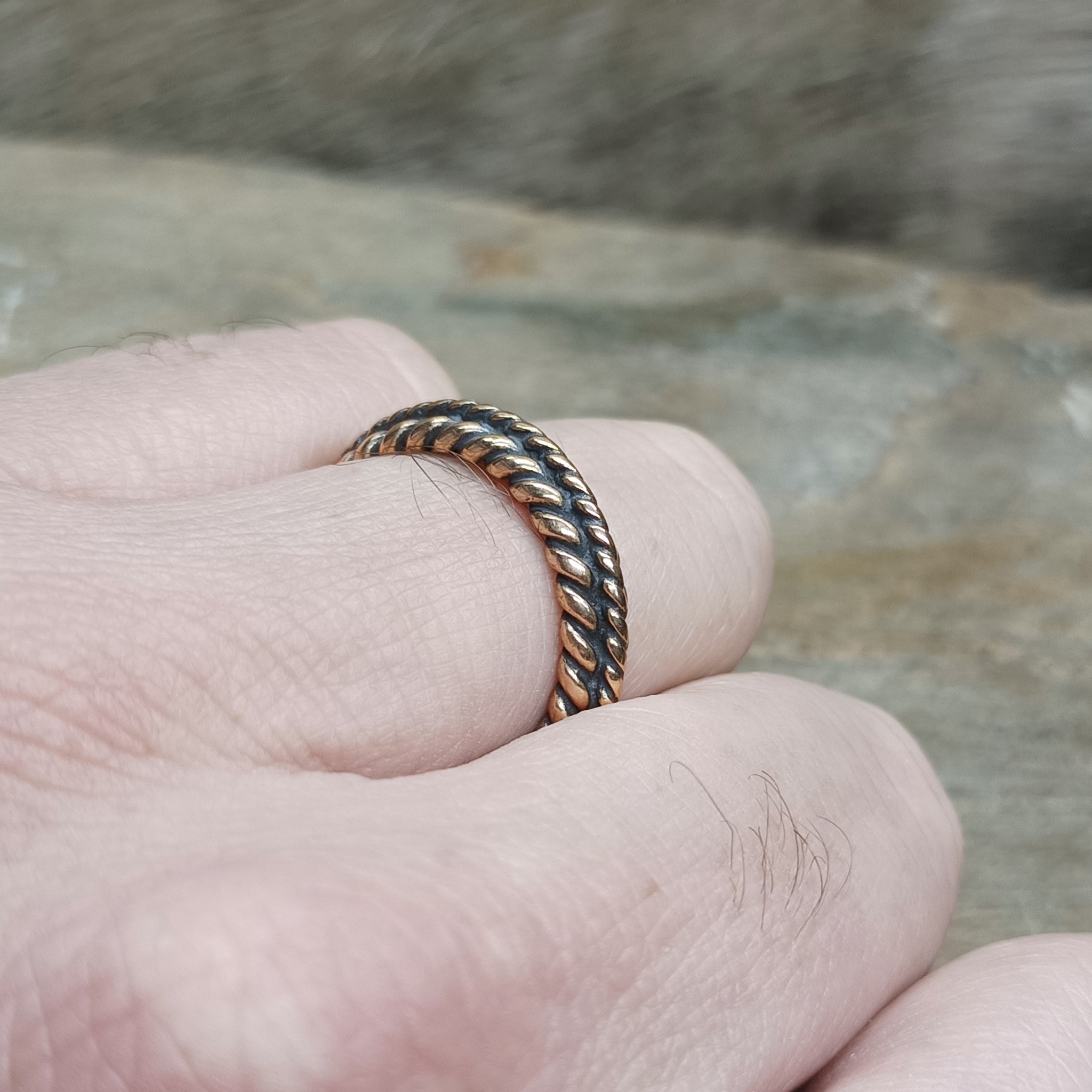Bronze Braided Viking Ring on Finger - Side Angle View